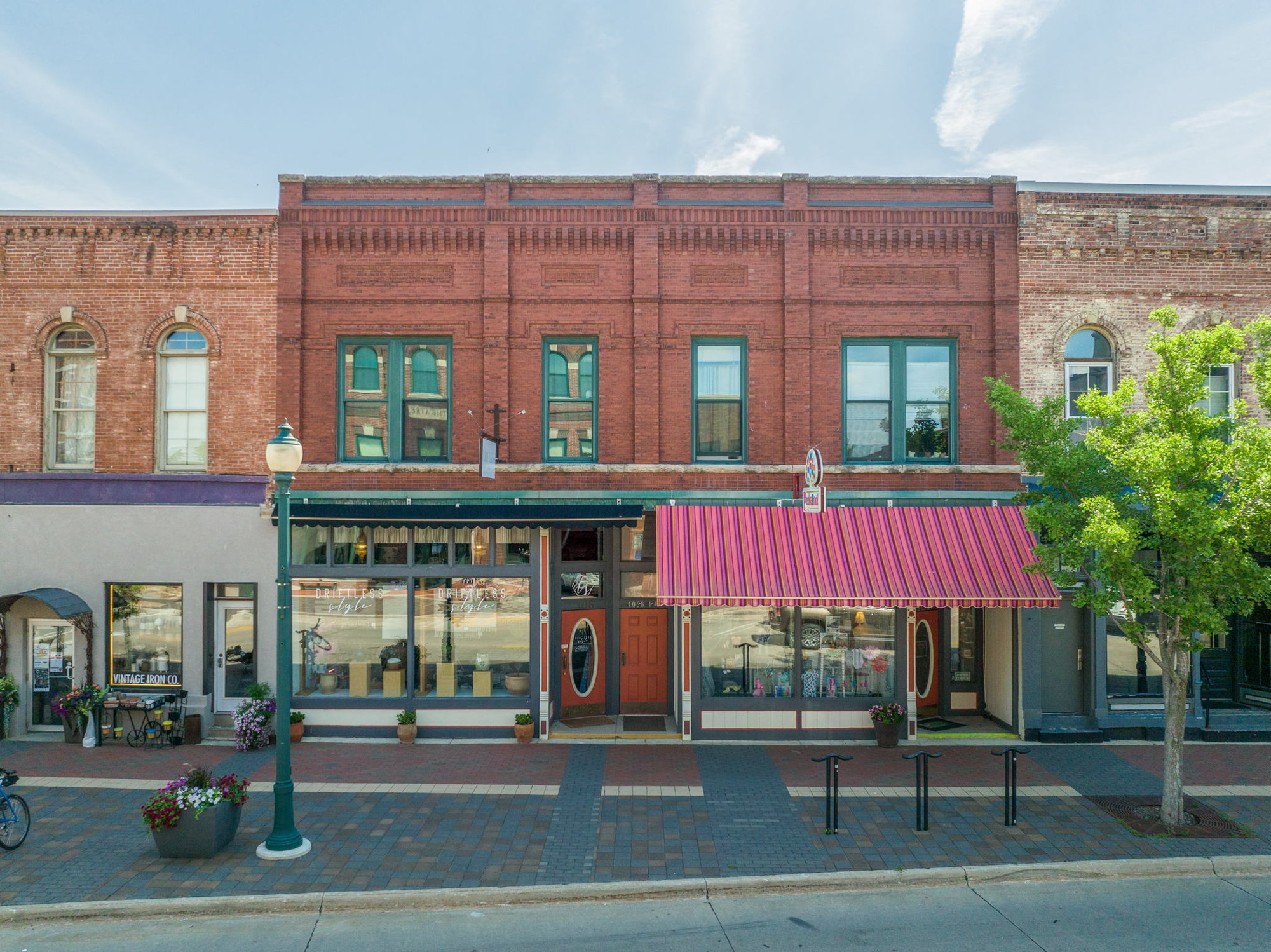 Historic Downtown Cedar Falls Storefront with 25YR old Business for Sale